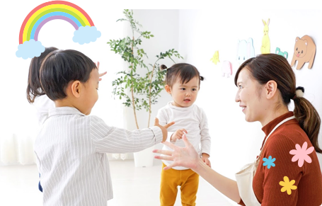 エプロン姿の女性と子ども達